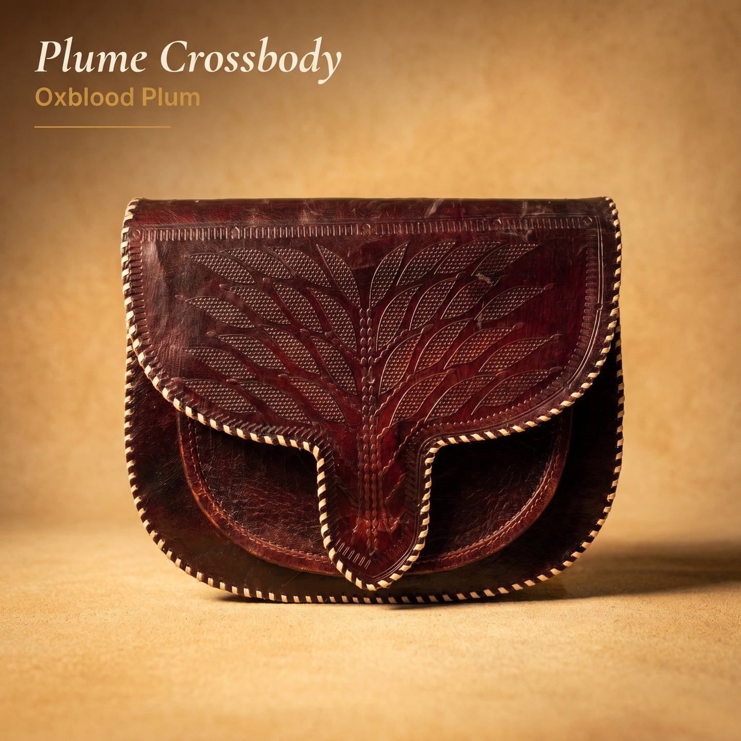 RAQZ Oxblood Plume Crossbody Bag — hand-tooled leather from Rajasthan, front view