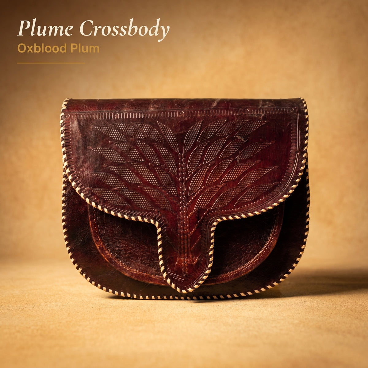 RAQZ Oxblood Plume Crossbody Bag — hand-tooled leather from Rajasthan, front view