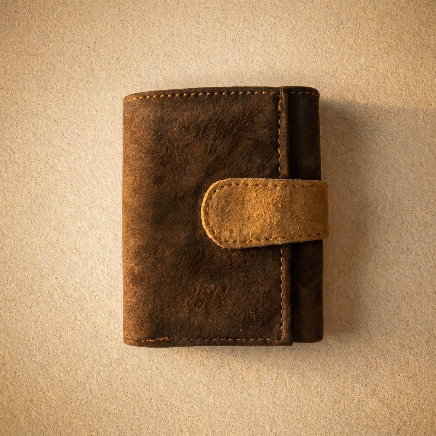 RAQZ Coffee Trifold Wallet — handcrafted suede leather from Rajasthan, overhead view